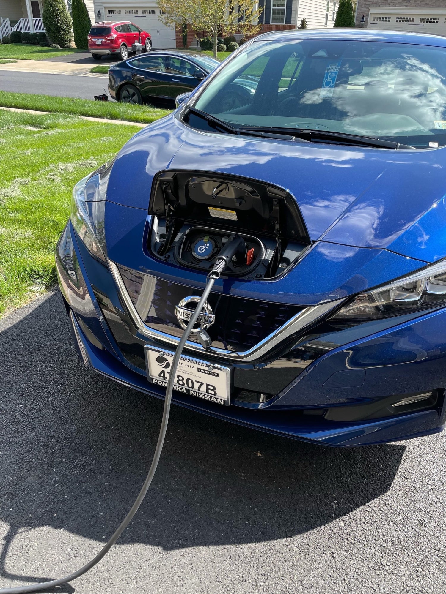 Electric vehicle Nissan charging. Garage Charge at home electric vehicle EV charging station installation. Free consultation for EV charger installation projects in Central Virginia, Richmond, Charlottesville, Harrisonburg, Lynchburg.